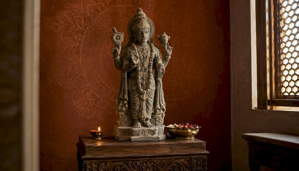 Antique bronze Hindu god statue on home altar